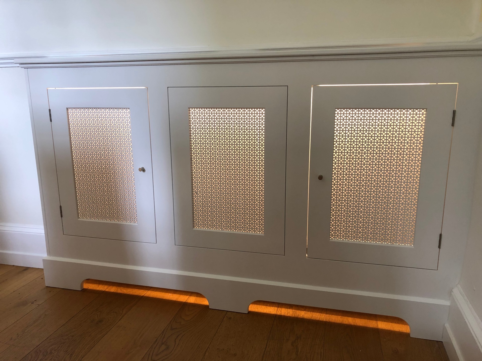 In-frame radiator cover with interior lighting